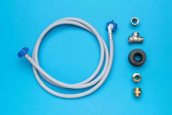 iStock Creator: KVLADMIRV A dishwasher installation kit on a blue background